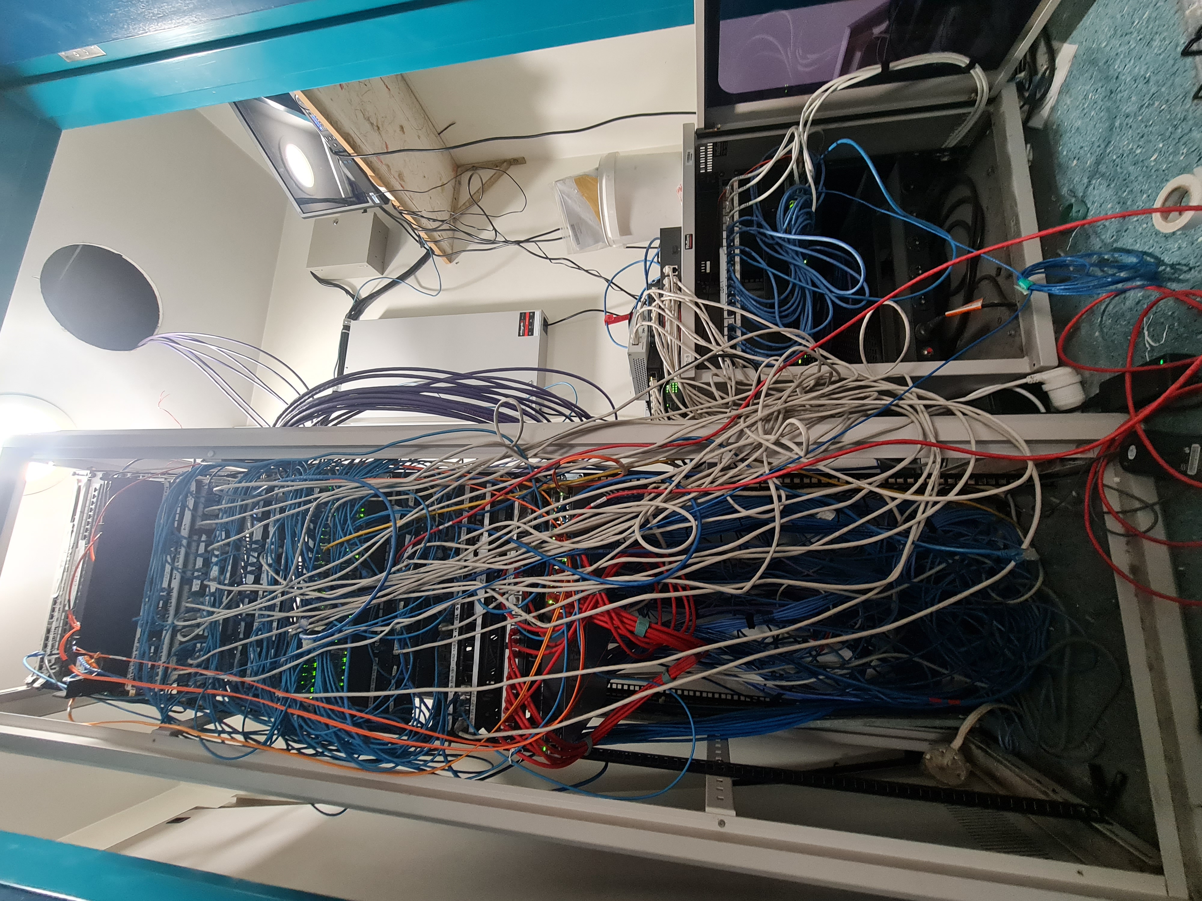Data rack before organization - messy cables and poor organization