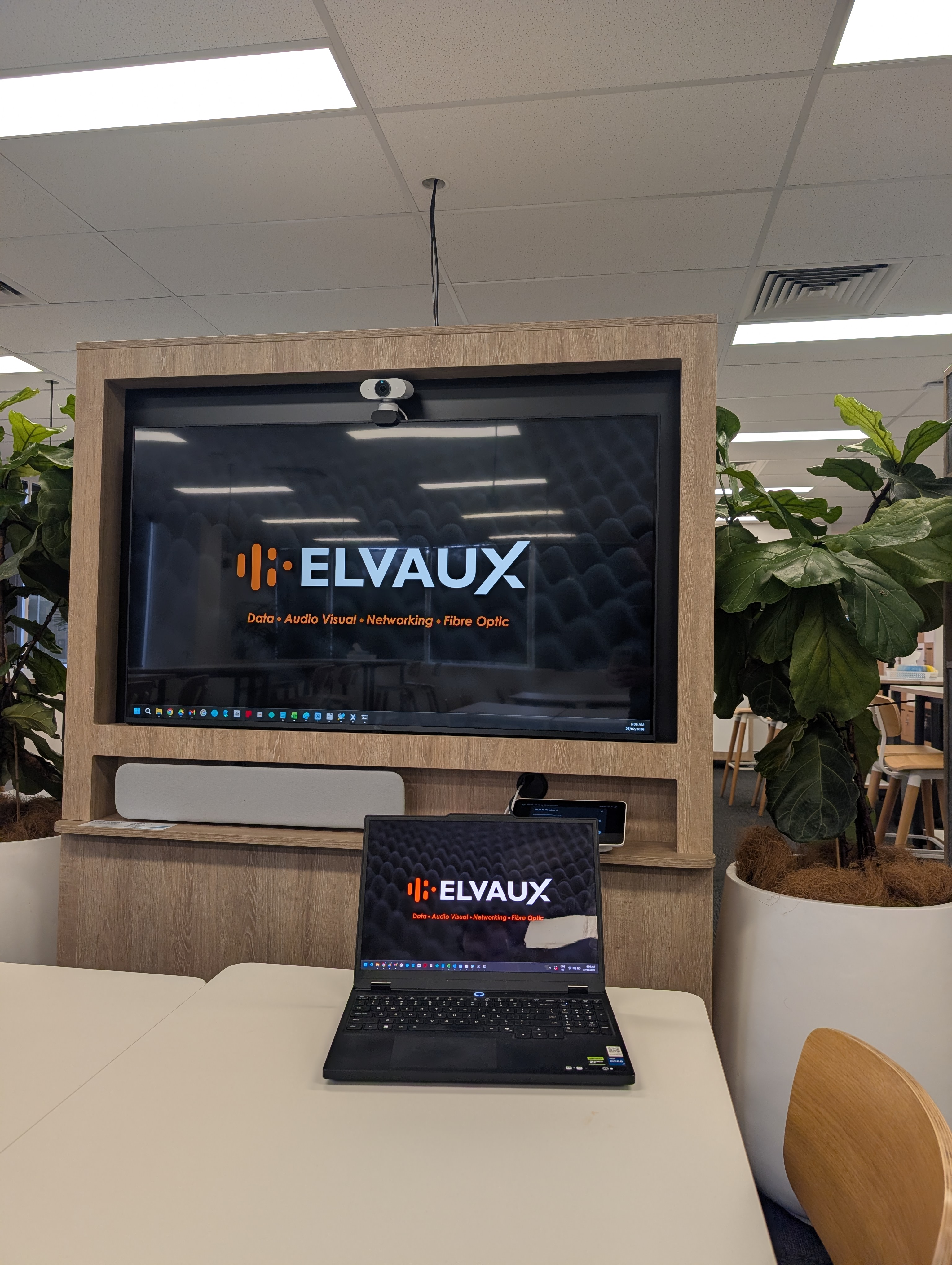 Meeting room with integrated display, soundbar, and touch control panel