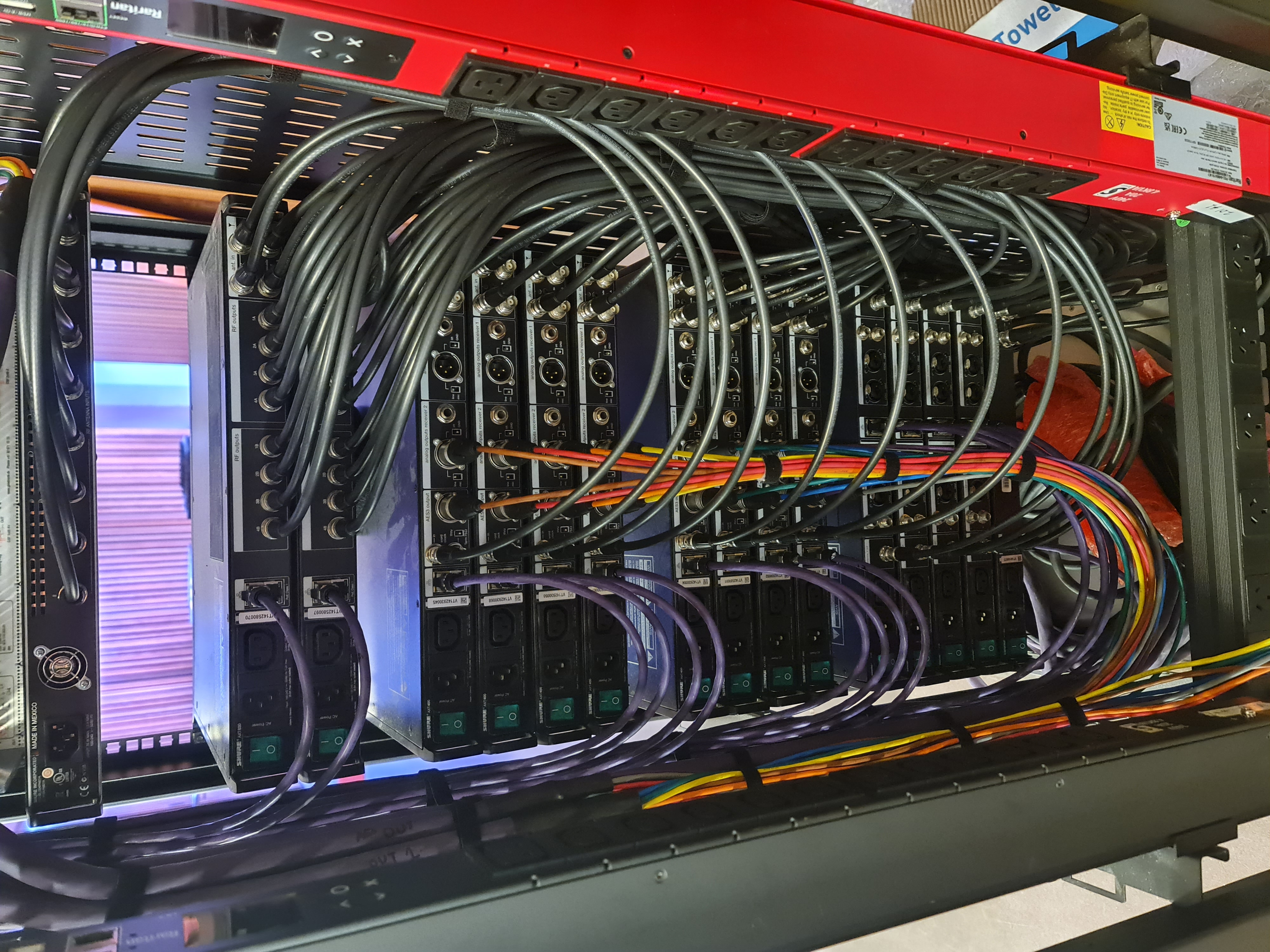 Rear of rack showing organised cable management and wireless distribution